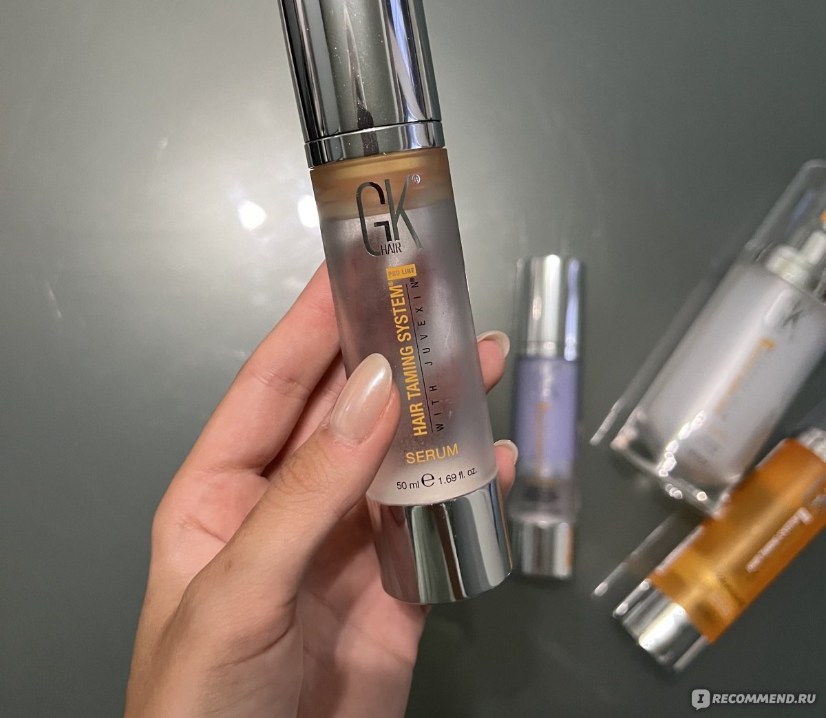 GK Hair Taming System Serum — серый флакон кератиновой сыворотки крупным планом